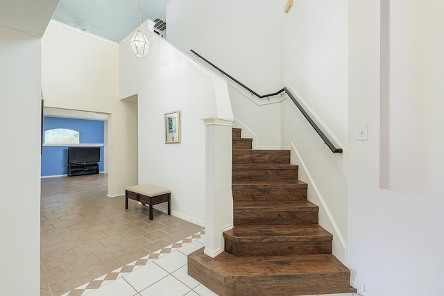 2103 Laurel Arbor Dr, Houston, TX 77014 - stairs with a high ceiling and tile patterned floors