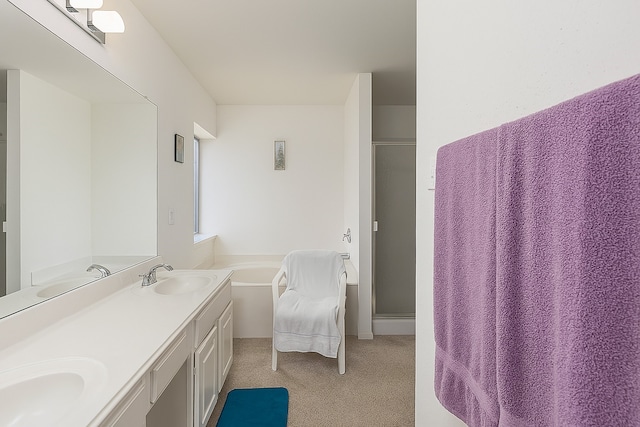 2103 Laurel Arbor Dr, Houston, TX 77014 - bathroom with a stall shower, double vanity, and a bath