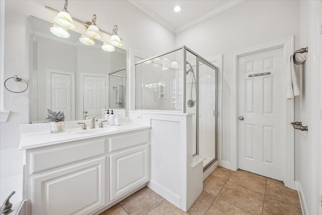 5638 Ballina Canyon Ln, Houston, TX 77041 - full bathroom with vanity, tile patterned flooring, a shower stall, and ornamental molding