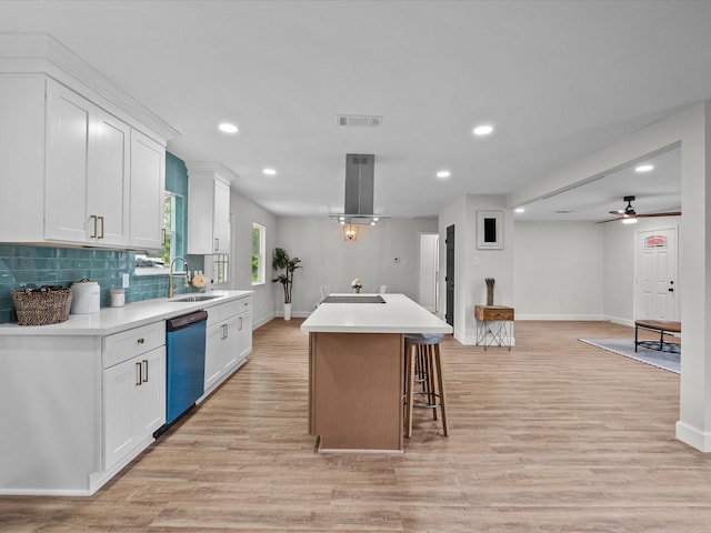 5225 Main St, Santa Fe, TX 77510 - kitchen with visible vents, baseboards, dishwashing machine, island exhaust hood, and a sink