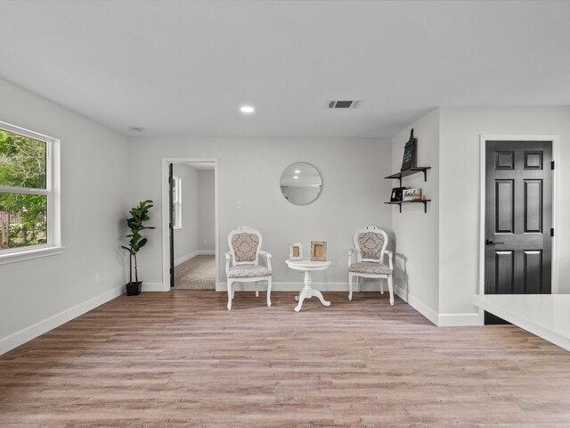 5225 Main St, Santa Fe, TX 77510 - sitting room featuring visible vents, light wood-style flooring, and baseboards
