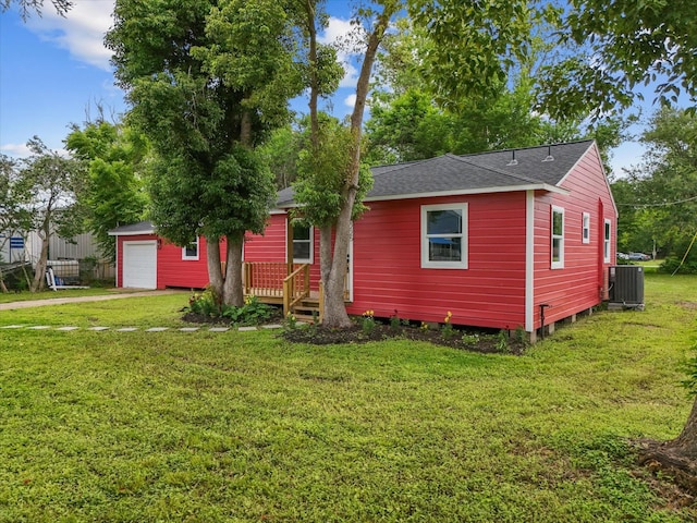 5225 Main St, Santa Fe, TX 77510 - ranch-style home with a shingled roof, central AC, a front yard, an outdoor structure, and driveway