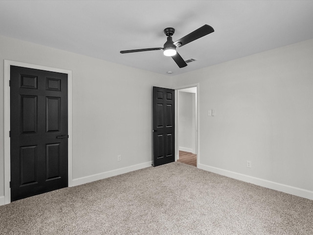 5225 Main St, Santa Fe, TX 77510 - unfurnished bedroom with carpet floors, baseboards, a ceiling fan, and visible vents