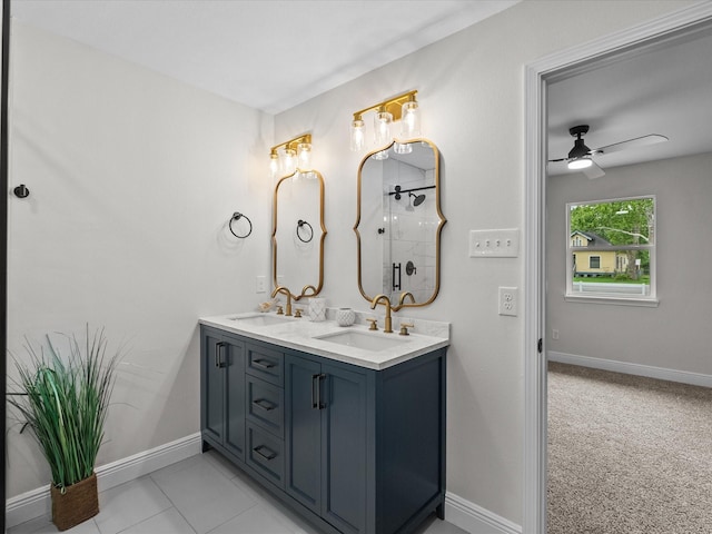 5225 Main St, Santa Fe, TX 77510 - bathroom with double vanity, a sink, baseboards, and a ceiling fan