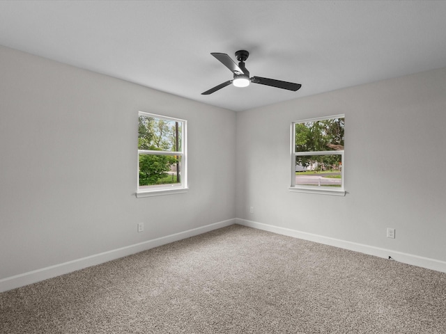 5225 Main St, Santa Fe, TX 77510 - carpeted empty room with baseboards and a ceiling fan