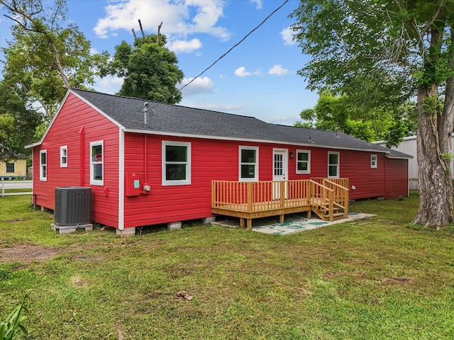 5225 Main St, Santa Fe, TX 77510 - rear view of property with a yard, central AC unit, a shingled roof, and a wooden deck