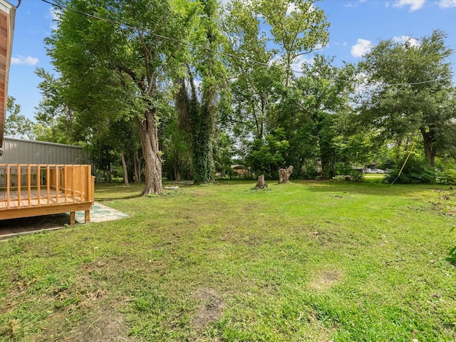 5225 Main St, Santa Fe, TX 77510 - view of yard featuring a deck
