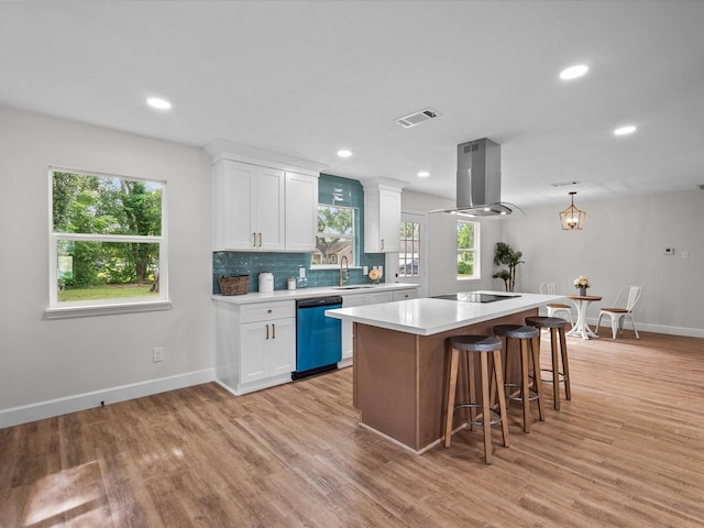5225 Main St, Santa Fe, TX 77510 - kitchen with dishwasher, light countertops, extractor fan, baseboards, and visible vents