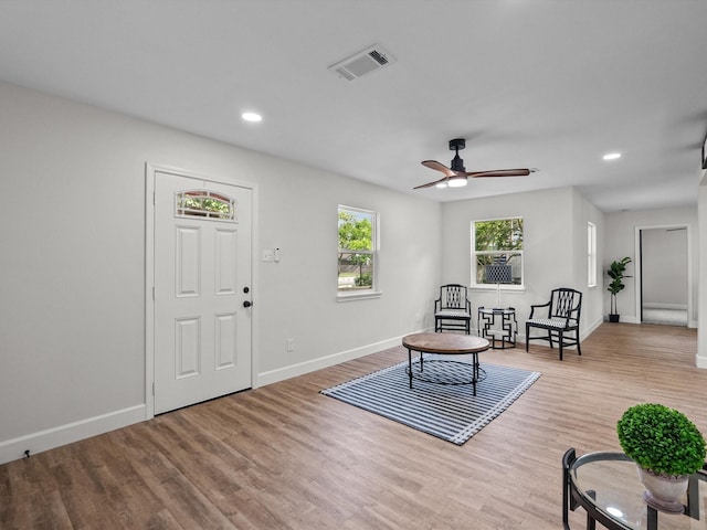 5225 Main St, Santa Fe, TX 77510 - living area with recessed lighting, baseboards, visible vents, and wood finished floors
