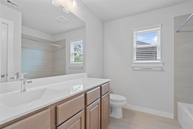 1904 Golden Spruce Ln, Conroe, TX 77301 - full bath with visible vents, vanity, toilet, baseboards, and shower / tub combination
