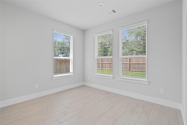 1904 Golden Spruce Ln, Conroe, TX 77301 - unfurnished room featuring baseboards, light wood finished floors, and visible vents