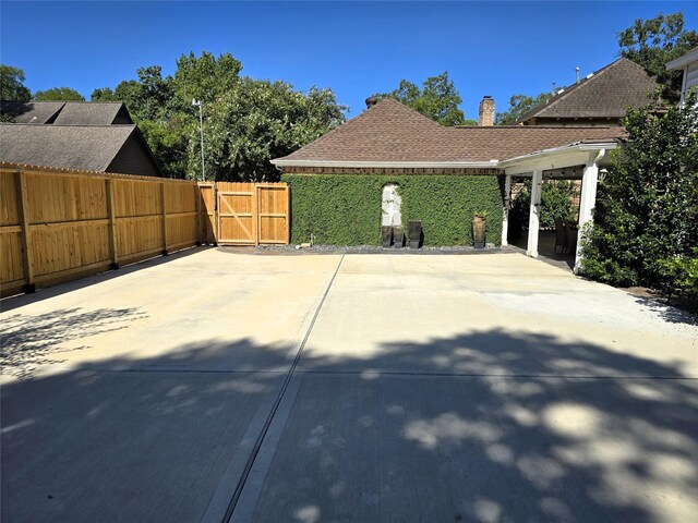 view of patio / terrace with fence and a gate