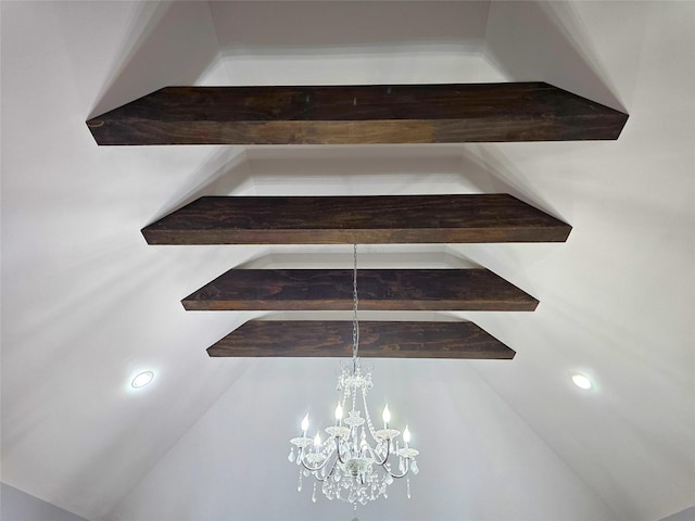 interior details featuring an inviting chandelier