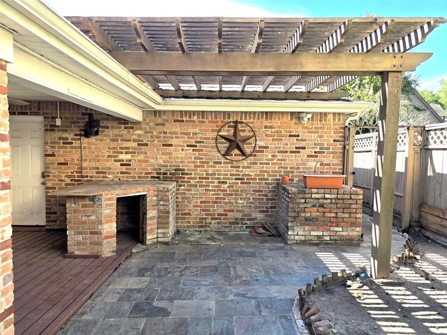 view of patio / terrace featuring fence and a pergola