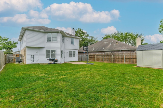9322 Colt Canyon Ln, Houston, TX 77089 - rear view of house with a patio, a fenced backyard, a chimney, and a storage unit