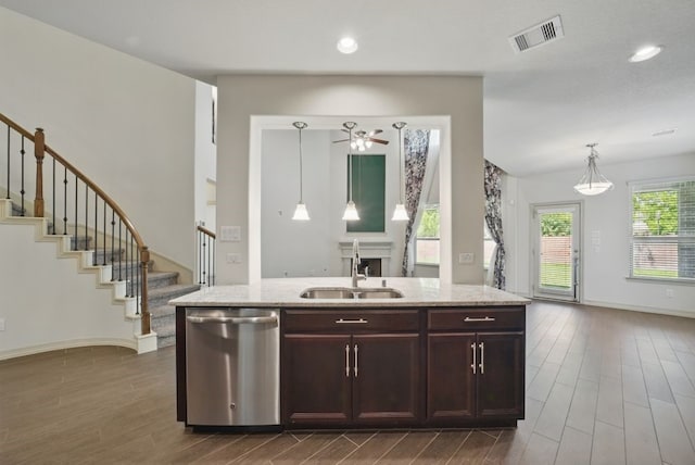 23 Castello Ln, Missouri City, TX 77459 - kitchen with stainless steel dishwasher, visible vents, ceiling fan, a sink, and dark wood finished floors
