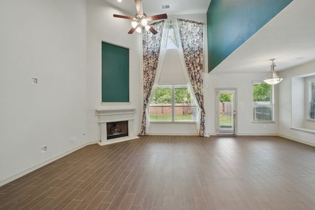 23 Castello Ln, Missouri City, TX 77459 - unfurnished living room featuring high vaulted ceiling, ceiling fan, baseboards, and a wealth of natural light