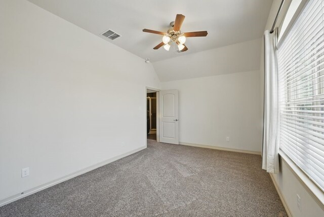 23 Castello Ln, Missouri City, TX 77459 - unfurnished room with carpet flooring, a ceiling fan, baseboards, and lofted ceiling