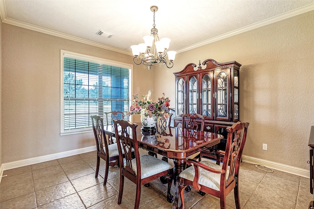dining space with ornamental molding, a textured wall, a chandelier, and visible vents
