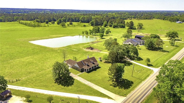 birds eye view of property featuring a water view and a rural view