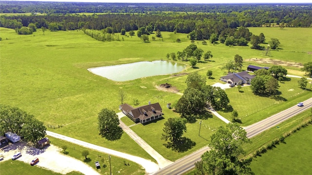 bird's eye view featuring a water view, a rural view, and a wooded view