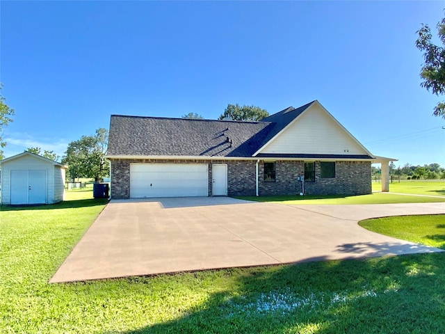 view of front of property featuring a front lawn, brick siding, a garage, a shed, and concrete driveway