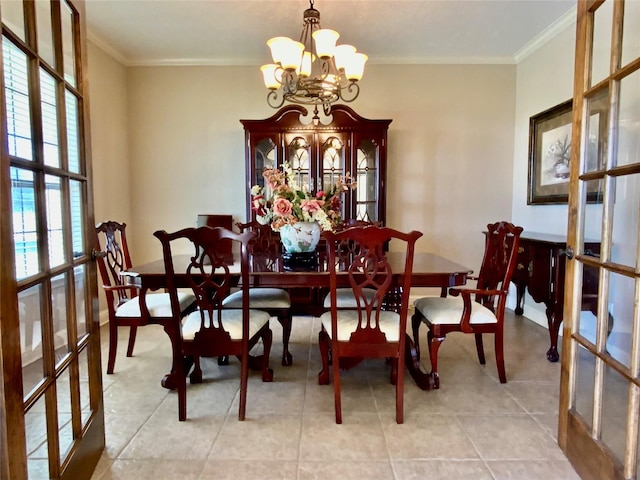 tiled dining room with crown molding, baseboards, a notable chandelier, and french doors