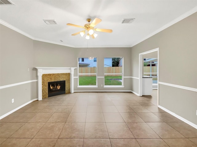 unfurnished living room with visible vents, ornamental molding, and ceiling fan