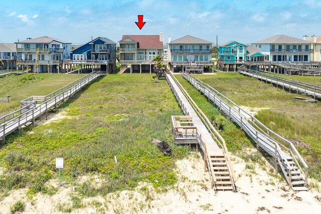 2330 Blue Water Hwy, Surfside Beach, TX 77541 - view of property's community featuring a residential view, a lawn, and stairway