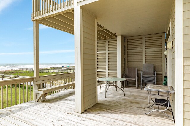 2330 Blue Water Hwy, Surfside Beach, TX 77541 - wooden deck featuring a view of the beach and a water view