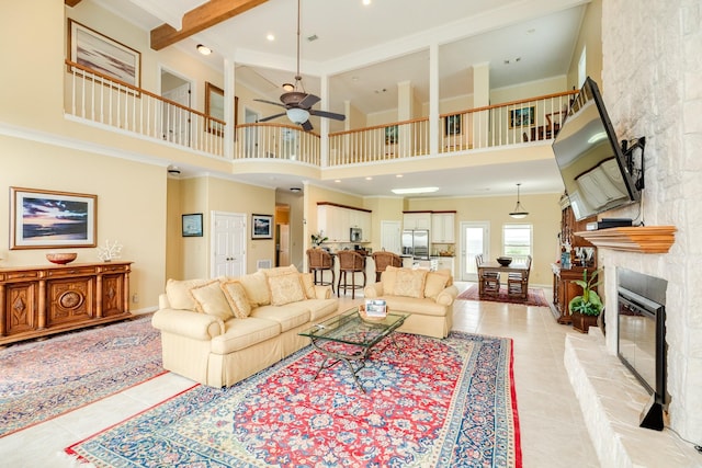 2330 Blue Water Hwy, Surfside Beach, TX 77541 - living area with a towering ceiling, ceiling fan, light tile patterned floors, and a fireplace