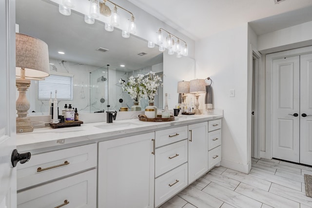 10503 Metronome Dr, Houston, TX 77043 - bathroom with vanity, visible vents, marble finish floor, and a stall shower