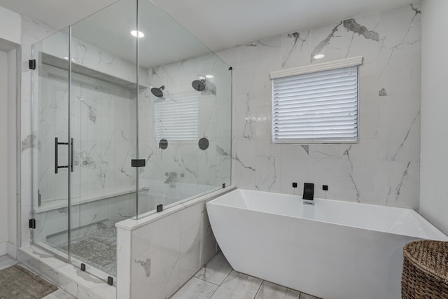10503 Metronome Dr, Houston, TX 77043 - bathroom featuring a freestanding bath, a marble finish shower, and marble finish floor