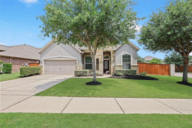 10418 Texas Sage Way, Cypress, TX 77433 - view of front of house with stone siding, stucco siding, a garage, and driveway