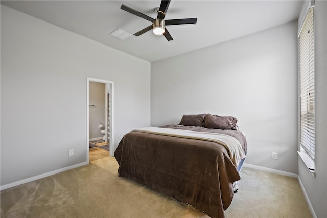 10418 Texas Sage Way, Cypress, TX 77433 - bedroom with light colored carpet, ensuite bath, and a ceiling fan