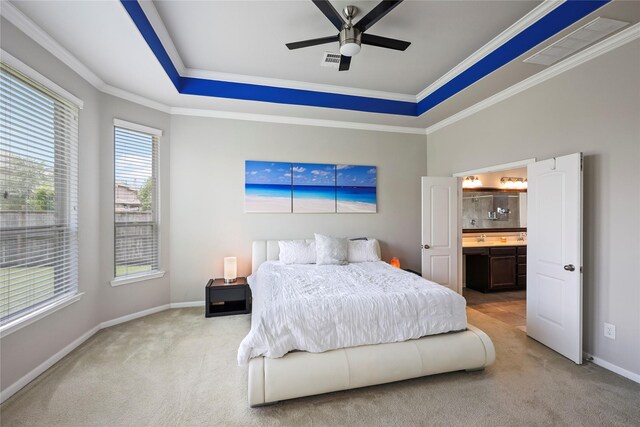 bedroom featuring a raised ceiling, baseboards, carpet, and visible vents