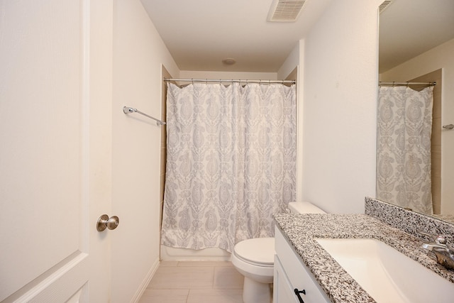 bathroom featuring toilet, visible vents, and vanity