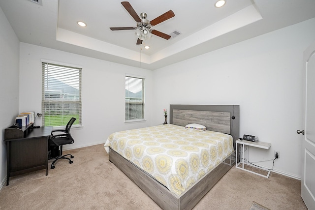 bedroom featuring recessed lighting, carpet flooring, baseboards, and a tray ceiling