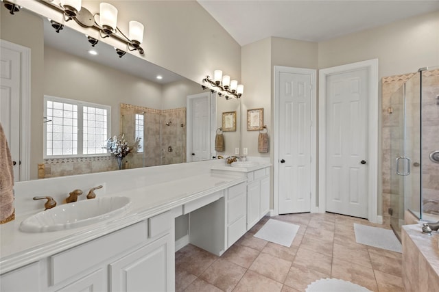 17714 W Copper Lakes Dr, Houston, TX 77095 - full bathroom featuring double vanity, a sink, a stall shower, and tile patterned flooring