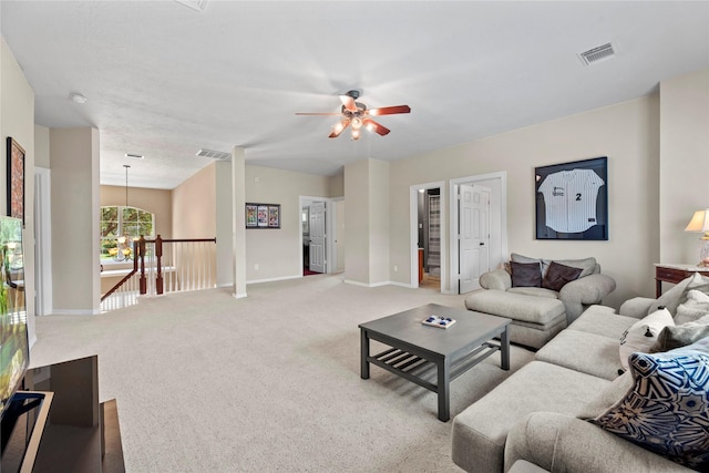 17714 W Copper Lakes Dr, Houston, TX 77095 - living area featuring visible vents, a ceiling fan, baseboards, and carpet floors