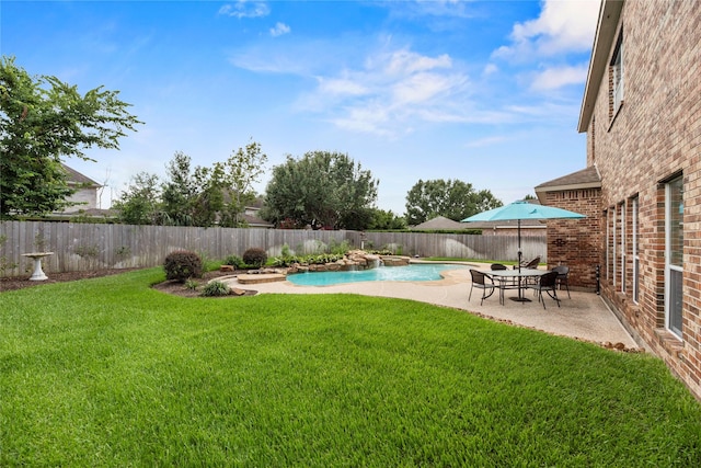17714 W Copper Lakes Dr, Houston, TX 77095 - view of yard with a fenced in pool, a fenced backyard, and a patio