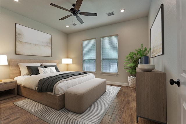 bedroom featuring baseboards, recessed lighting, wood finished floors, and visible vents