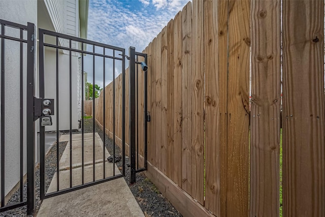 view of gate featuring fence