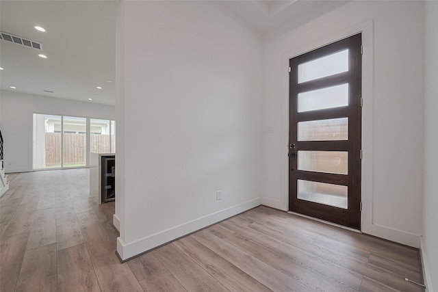 entryway featuring recessed lighting, baseboards, visible vents, and wood finished floors