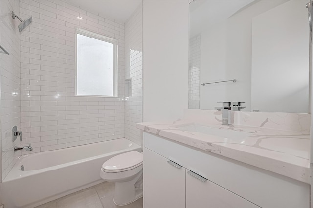 bathroom featuring washtub / shower combination, tile patterned floors, vanity, and toilet