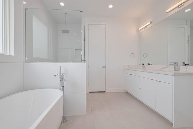 full bathroom with vanity, recessed lighting, tile patterned floors, and a soaking tub