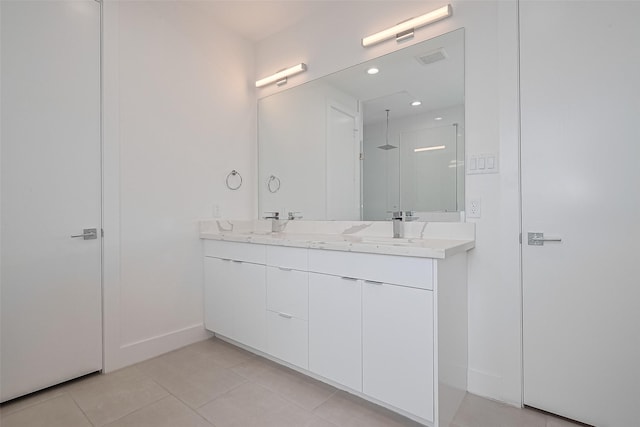 bathroom featuring a walk in shower, a sink, tile patterned flooring, double vanity, and visible vents