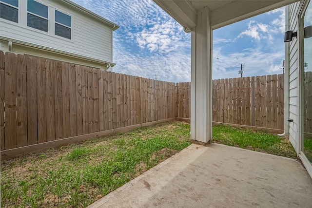 view of yard with a patio and a fenced backyard