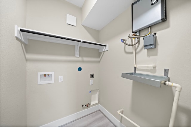 washroom featuring gas dryer hookup, washer hookup, laundry area, electric dryer hookup, and baseboards