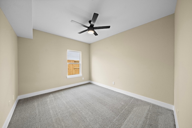 unfurnished room with carpet floors, baseboards, and ceiling fan